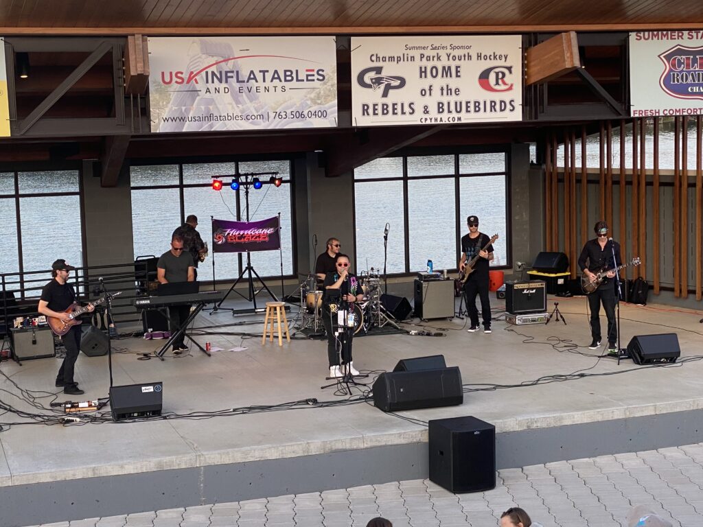 band performing on an outdoor stage