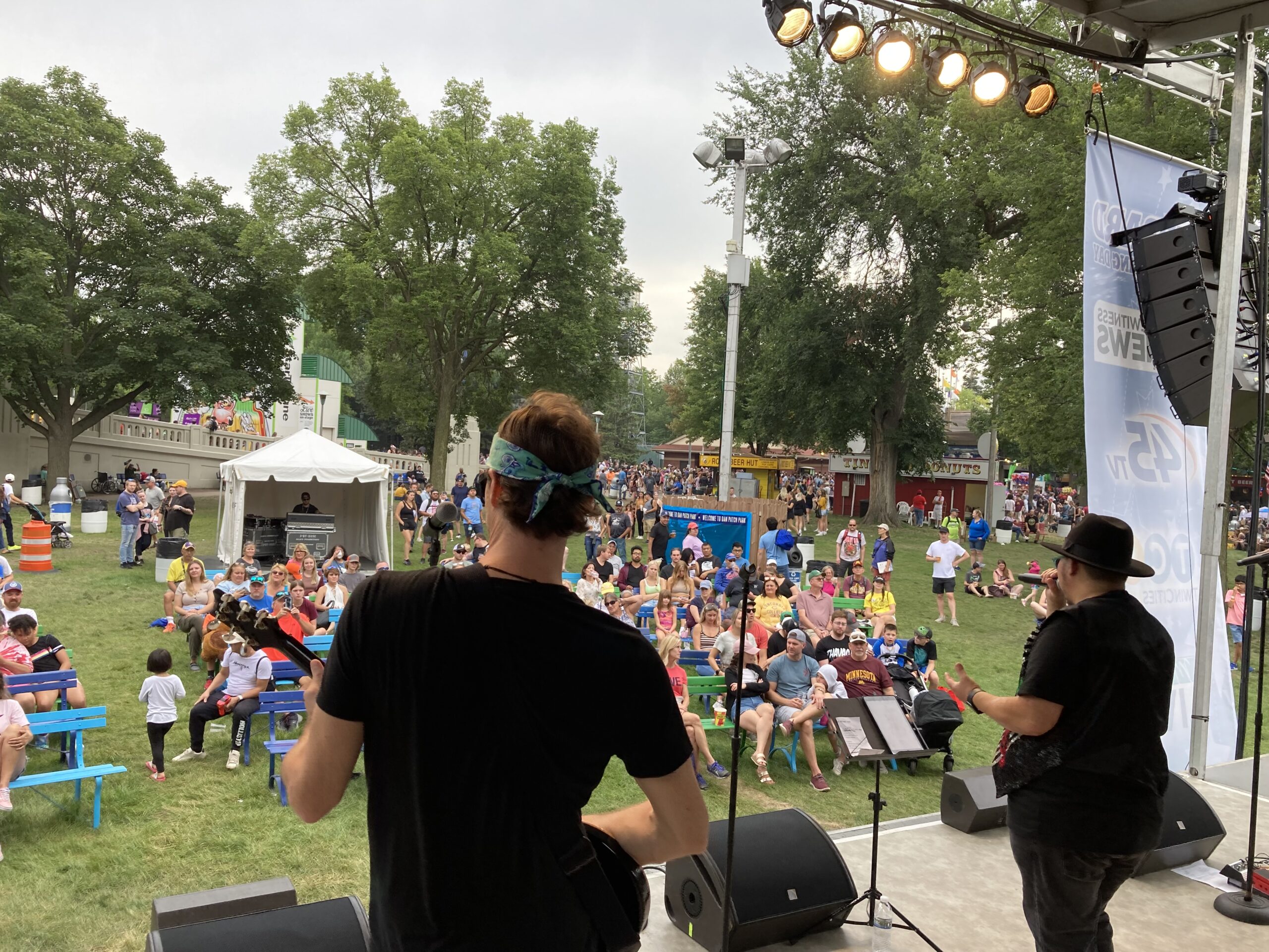 band performing on large outdoor stage