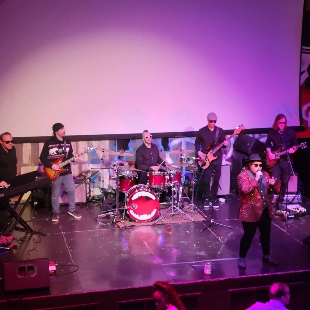 band performing on an indoor stage