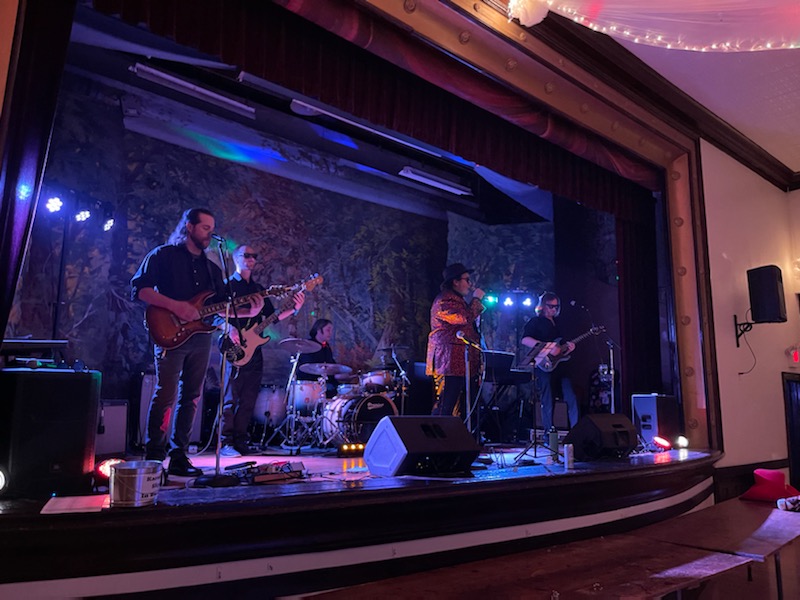 band performing on an indoor stage